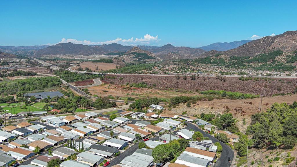 4650 Dulin Road, Unit 178 Fallbrook, CA 92003 - Photo 44 of 56 an aerial view of residential houses with outdoor space and trees