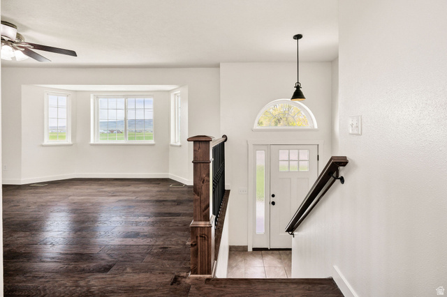 365 South Center Street Fielding, UT 84311 - Photo 7 of 41 Entrance foyer with dark wood-style flooring and ceiling fan