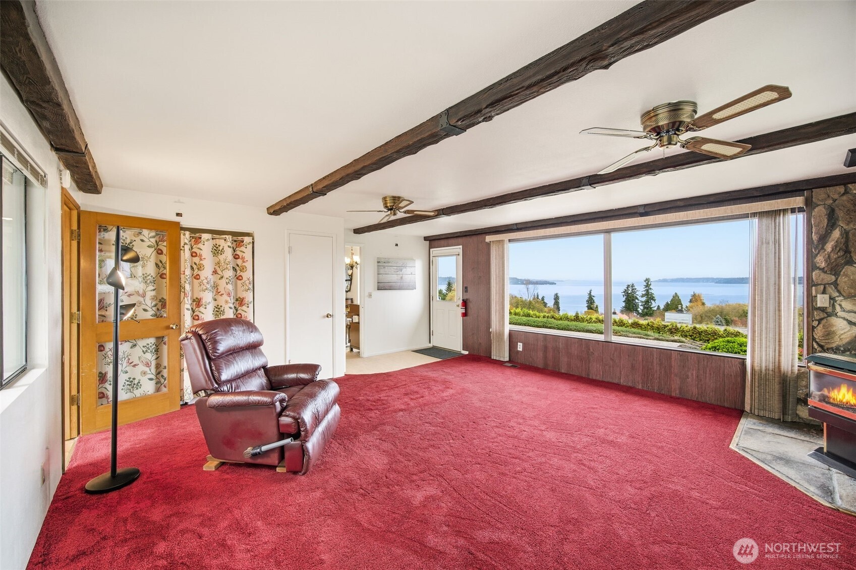 204 Southwest 298th Place Federal Way, WA 98023 - Photo 11 of 31 a living room with furniture a floor to ceiling window and a flat screen tv