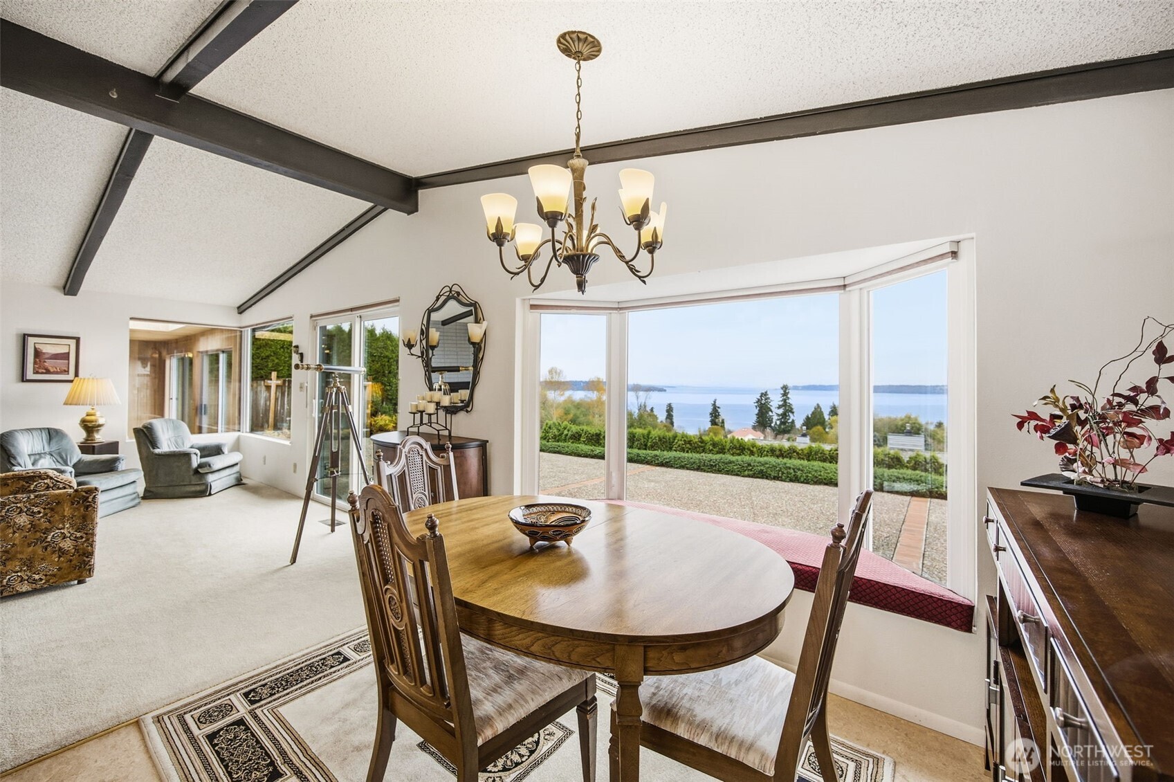 204 Southwest 298th Place Federal Way, WA 98023 - Photo 12 of 31 a view of a dining room with furniture a chandelier and large windows