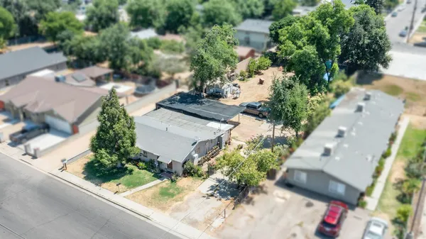 an aerial view of a house with yard and outdoor space