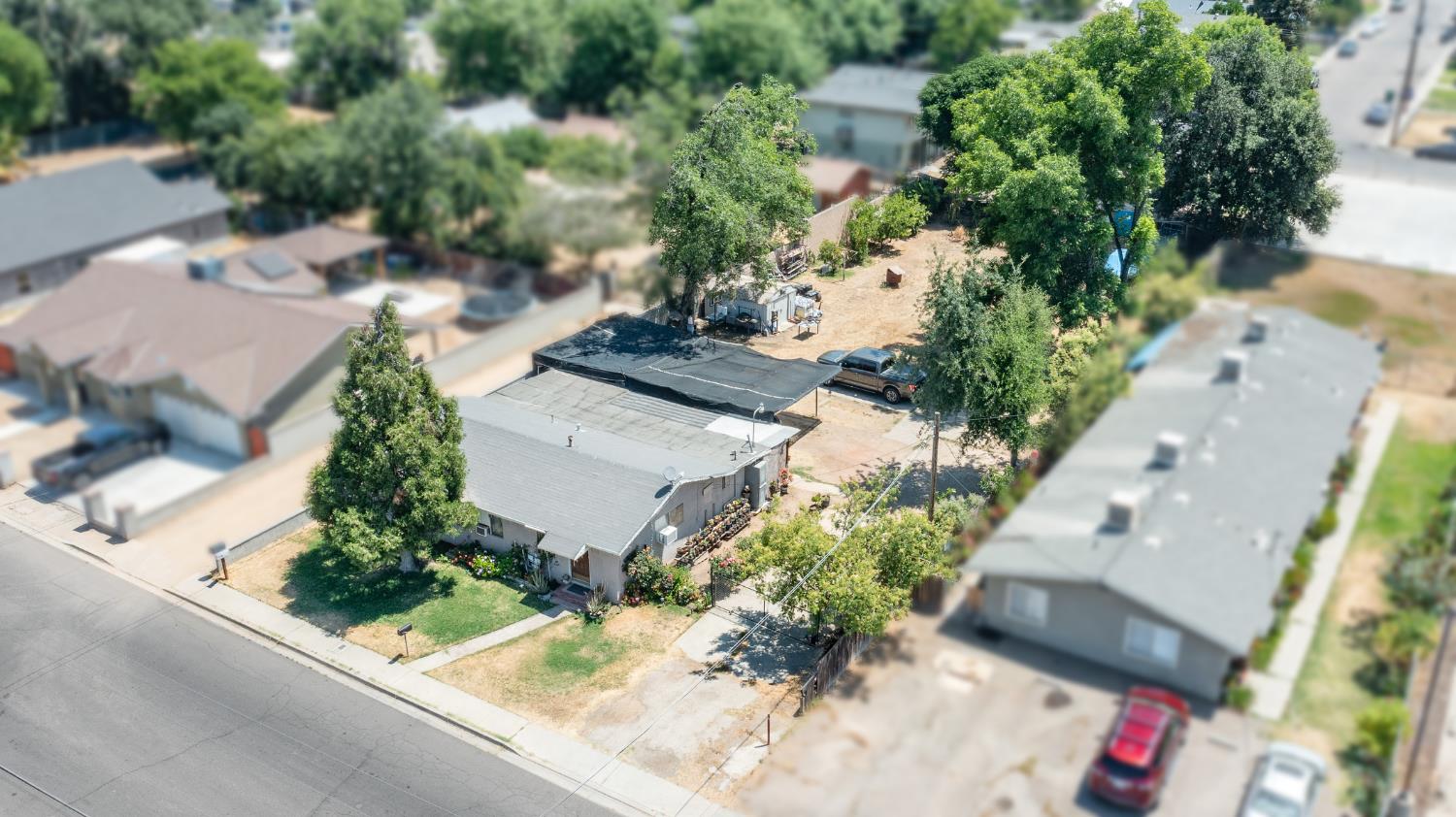 216 South Sunset Avenue Reedley, CA 93654 - Photo 4 of 6 an aerial view of a house with a yard