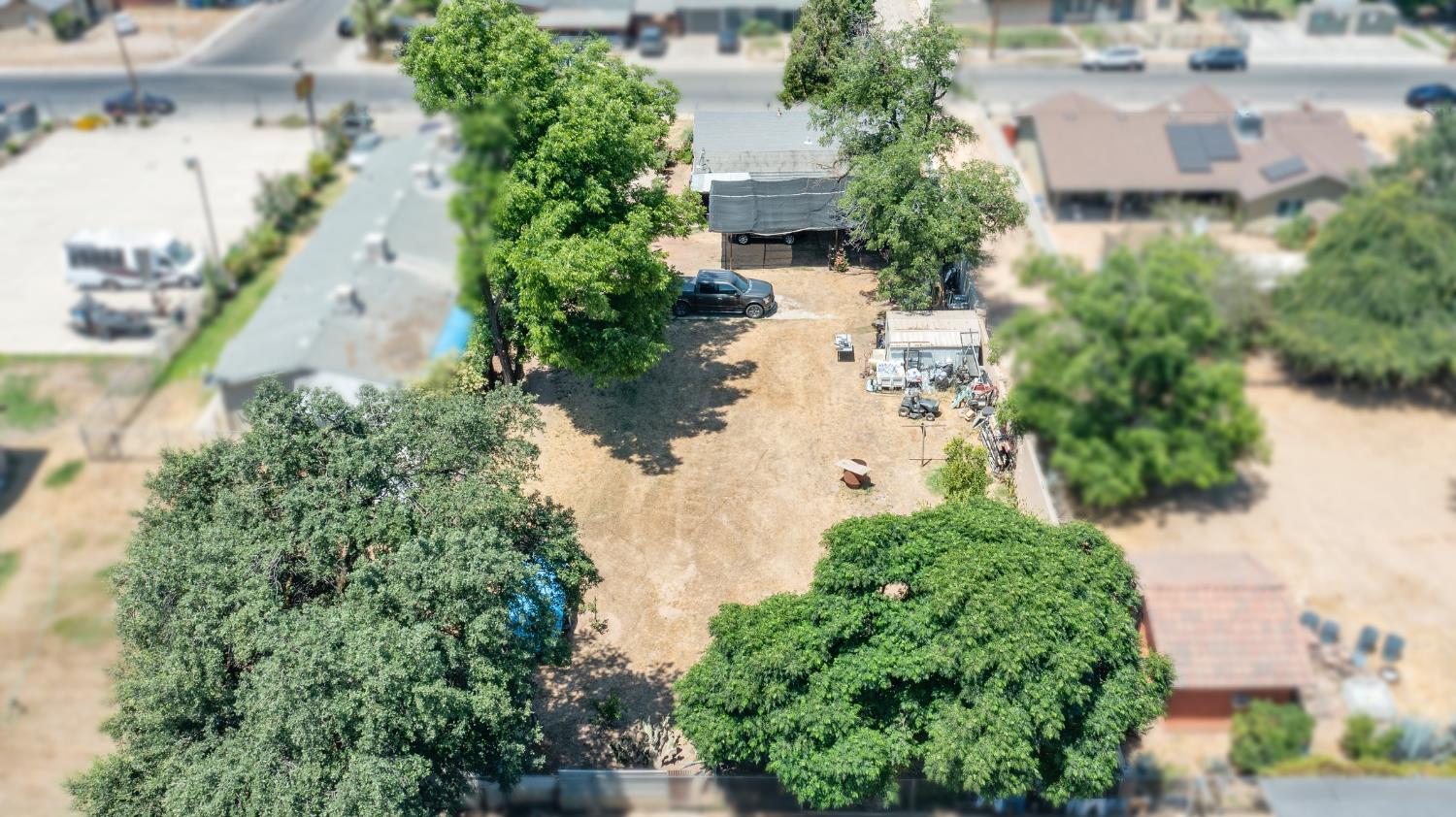 216 South Sunset Avenue Reedley, CA 93654 - Photo 5 of 6 an aerial view of a house with yard and outdoor space