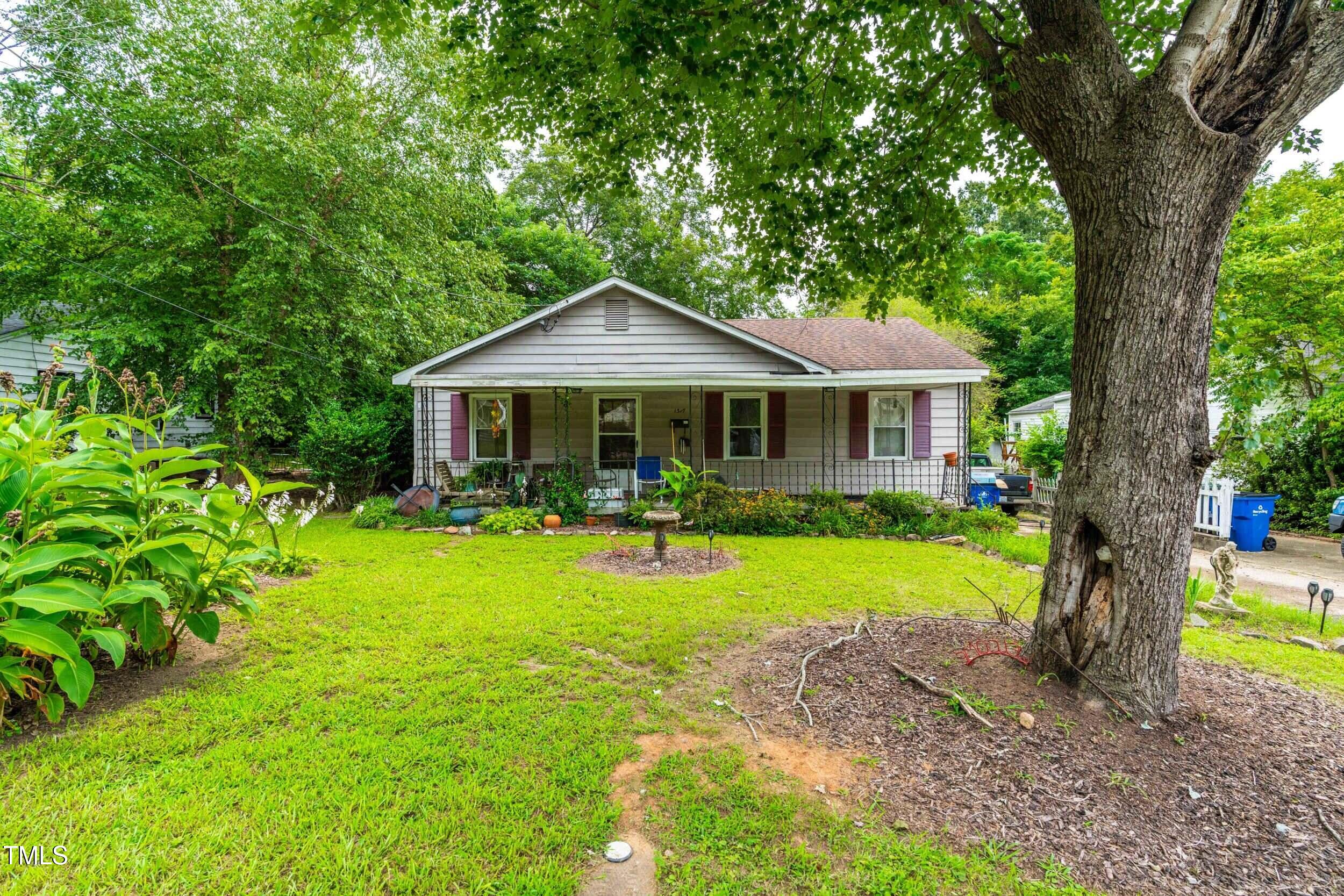 a front view of a house with swimming pool having outdoor seating