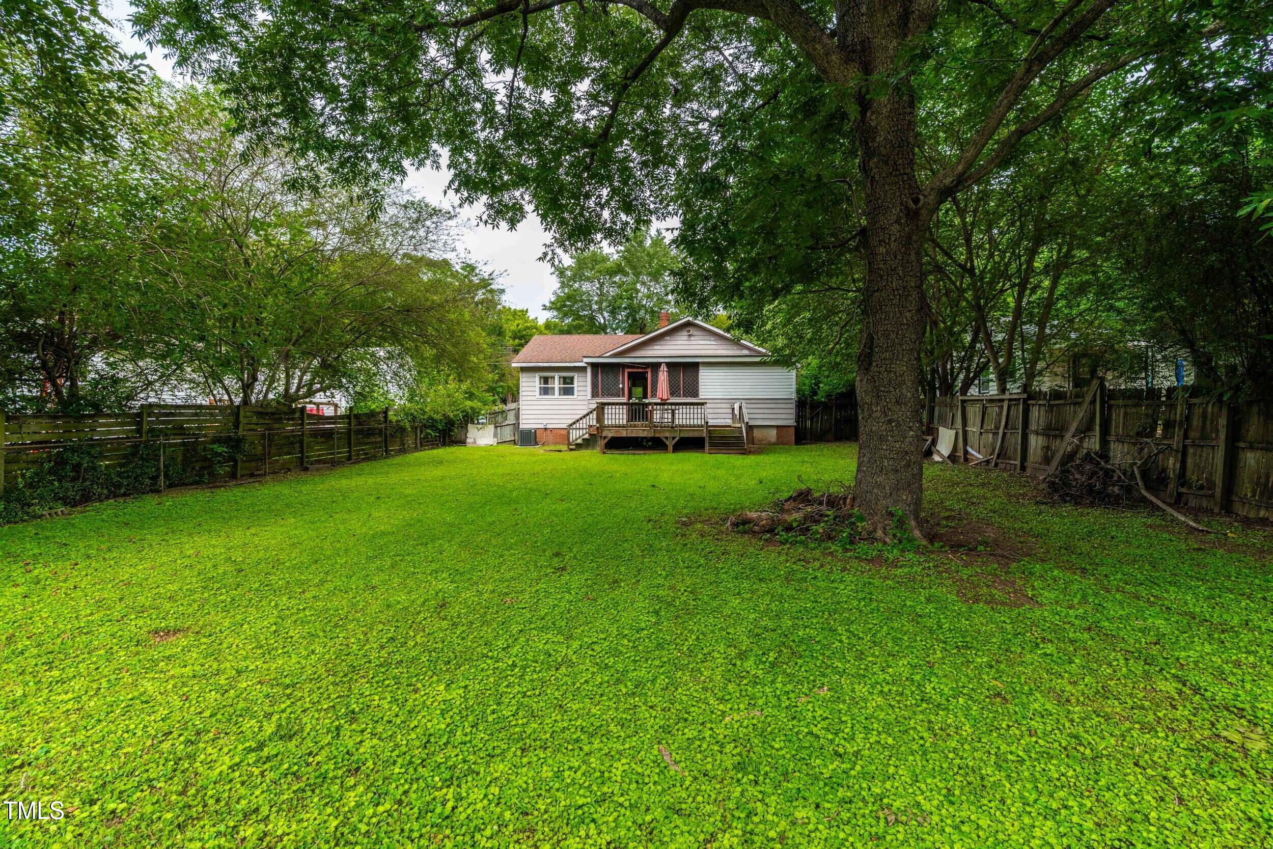 1317 Curfman Street Raleigh, NC 27603 - Photo 11 of 29 a front view of a house with garden
