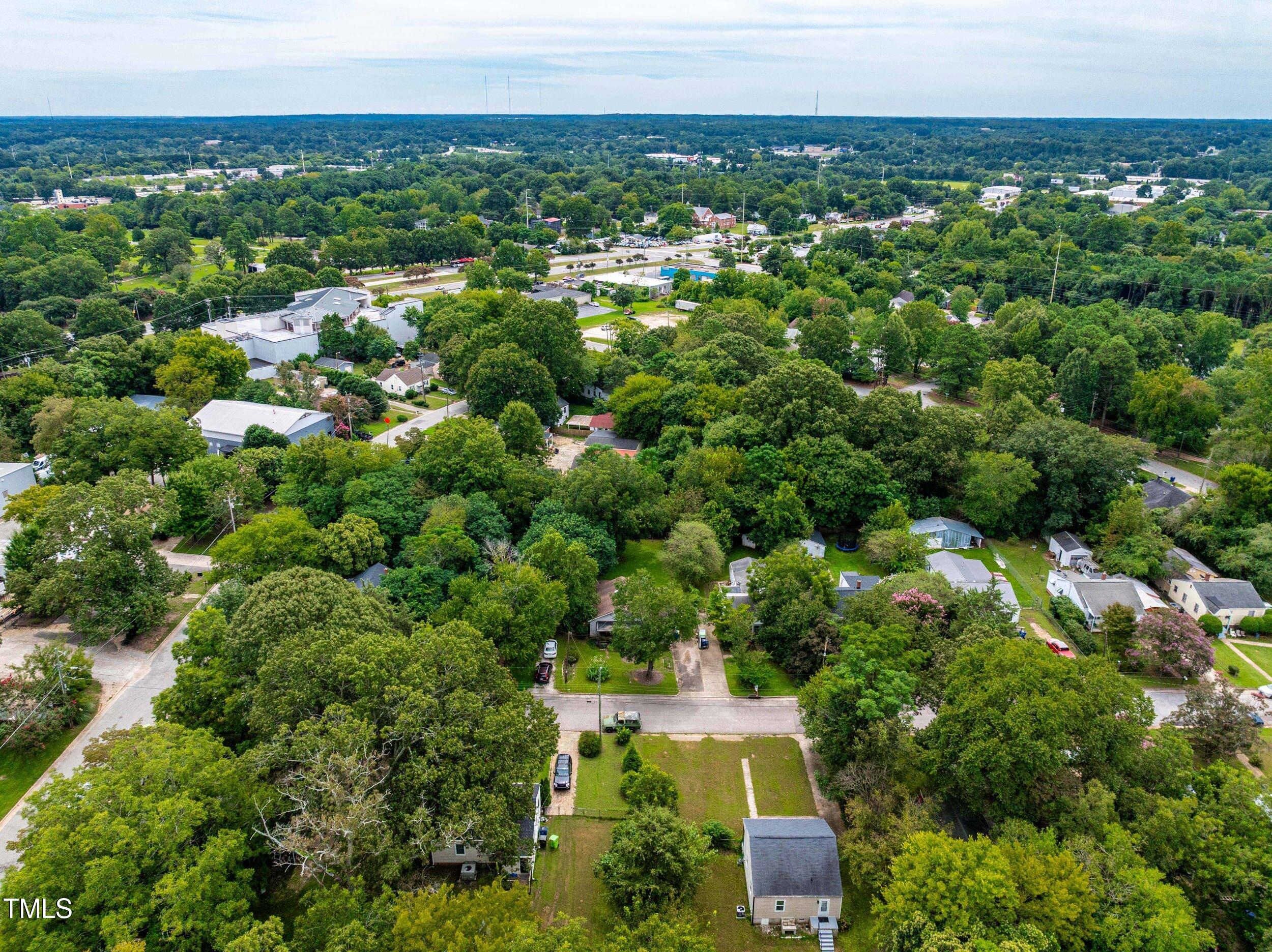 1317 Curfman Street Raleigh, NC 27603 - Photo 21 of 29 an aerial view of a house with a yard and lake view