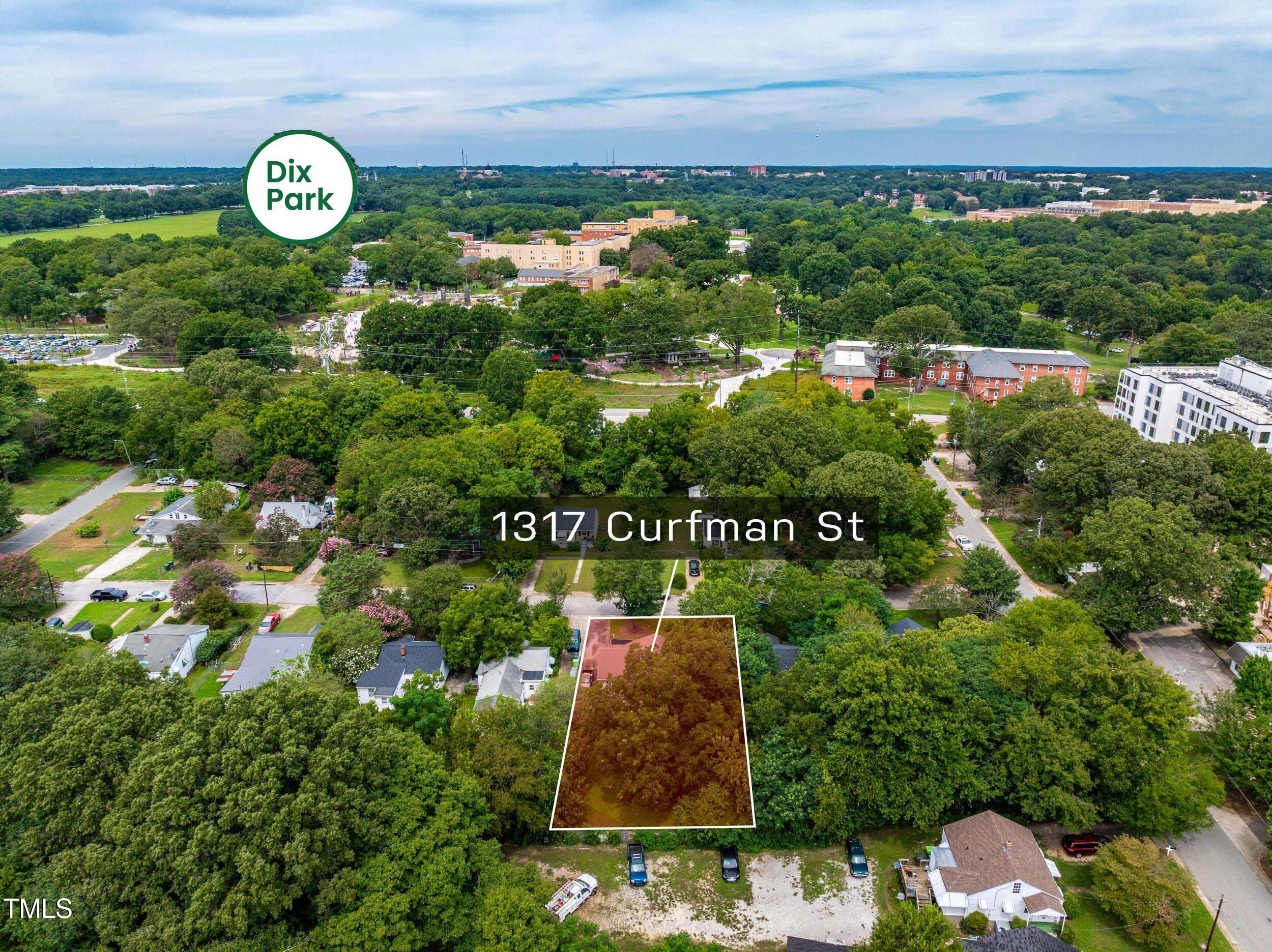 1317 Curfman Street Raleigh, NC 27603 - Photo 4 of 29 a sign that is sitting on a brick wall