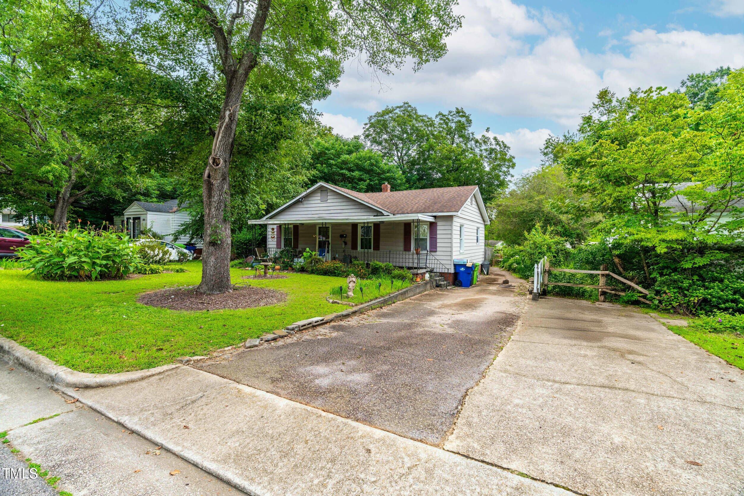 1317 Curfman Street Raleigh, NC 27603 - Photo 6 of 29 a front view of house with yard and green space