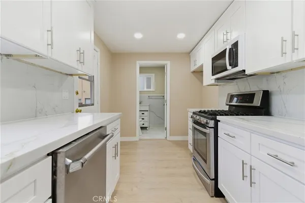 a bathroom with a toilet sink and shower