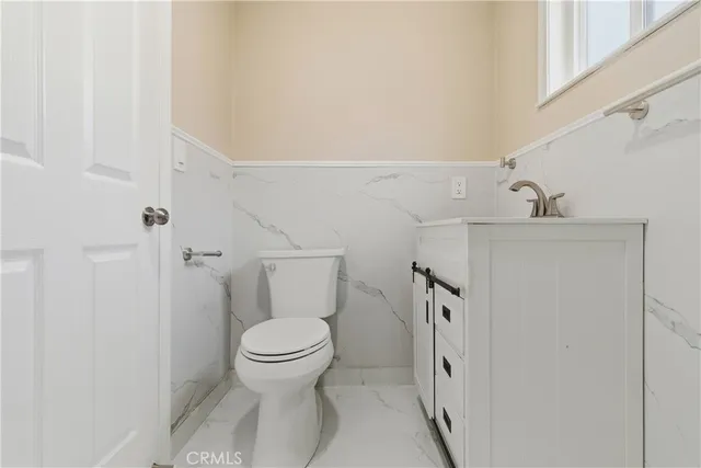 a white bath tub sitting next to a white sink