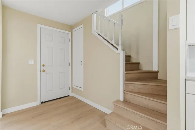 a view of entryway with wooden floor