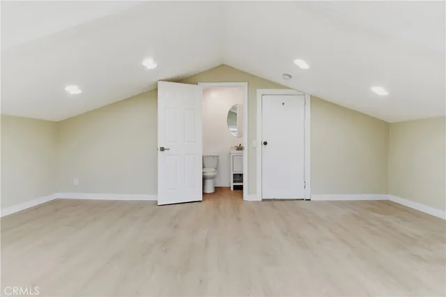 a view of a house with a small yard and plants