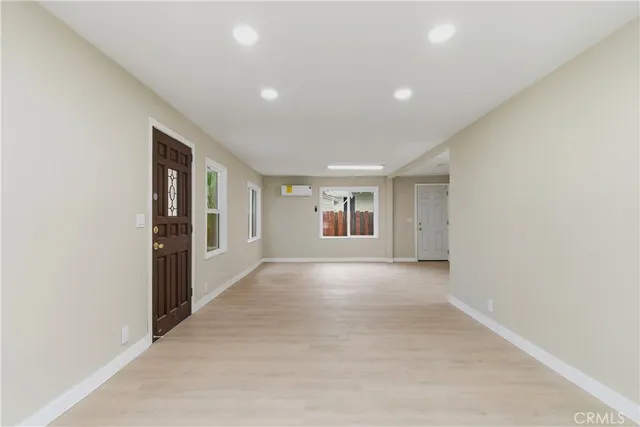 a view of a kitchen with a sink and cabinets