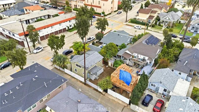 an aerial view of a house with a yard