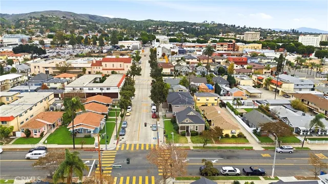 an aerial view of residential building and lake