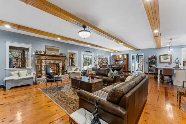 a large kitchen with a table and chairs