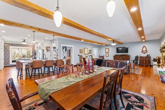 a bathroom with a granite countertop sink a toilet and mirror