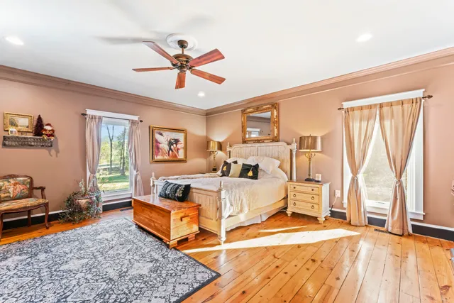 a work room with furniture and a flat screen tv