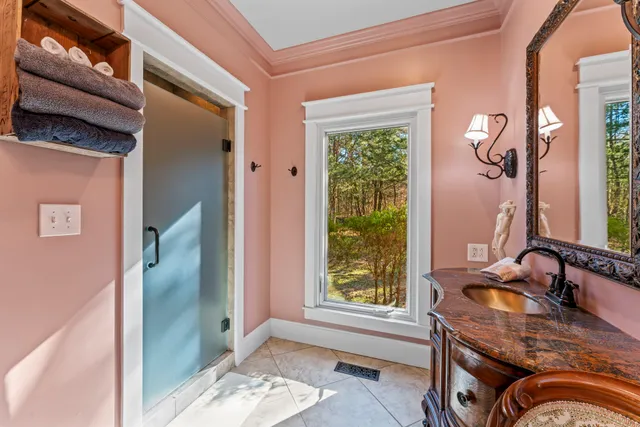 a bedroom with a bed and a fan