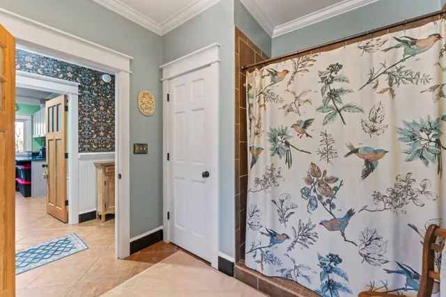 a patio with patio a table and chairs and potted plants