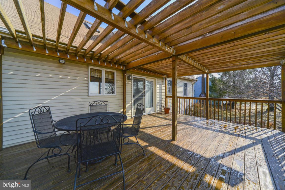320 East Lexington Road Lititz, PA 17543 - Photo 23 of 33 a view of a patio with table and chairs with wooden floor and fence