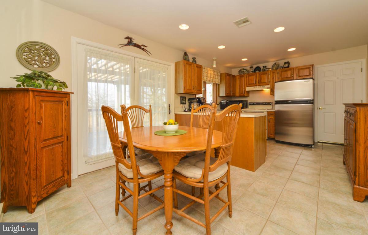 320 East Lexington Road Lititz, PA 17543 - Photo 6 of 33 a dining room with stainless steel appliances a table and chairs