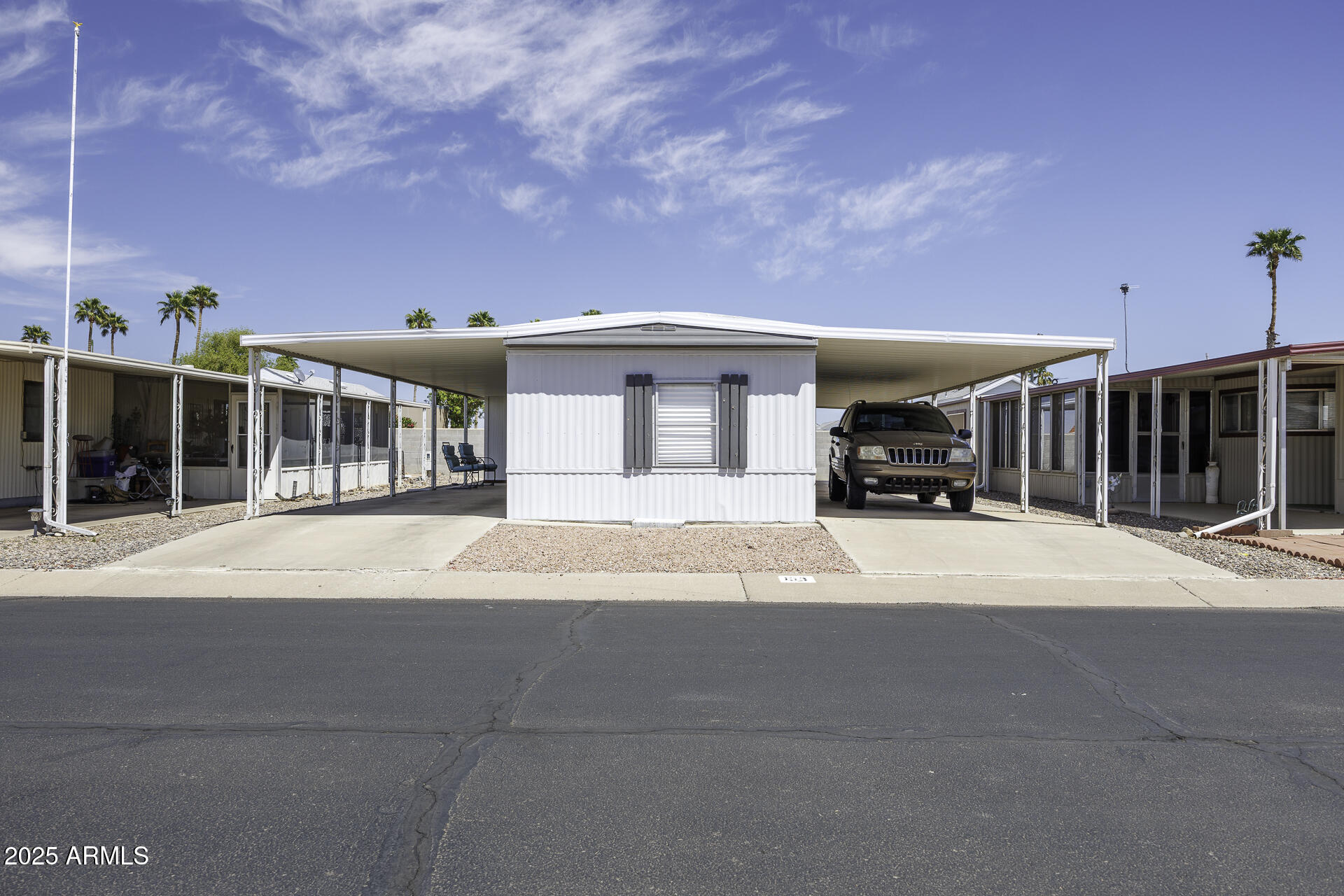 a view of building with car parked