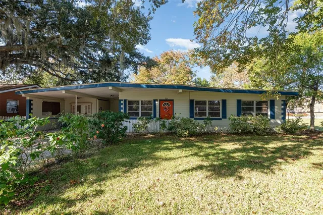a front view of house with yard and green space