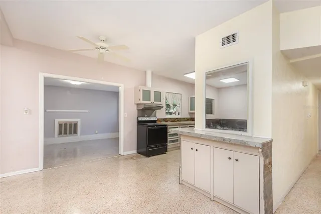 a large kitchen with a lot of counter space and appliances