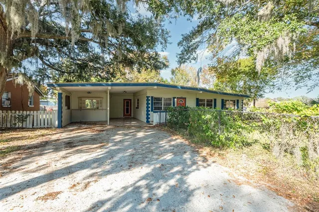 a room with white cabinets and window
