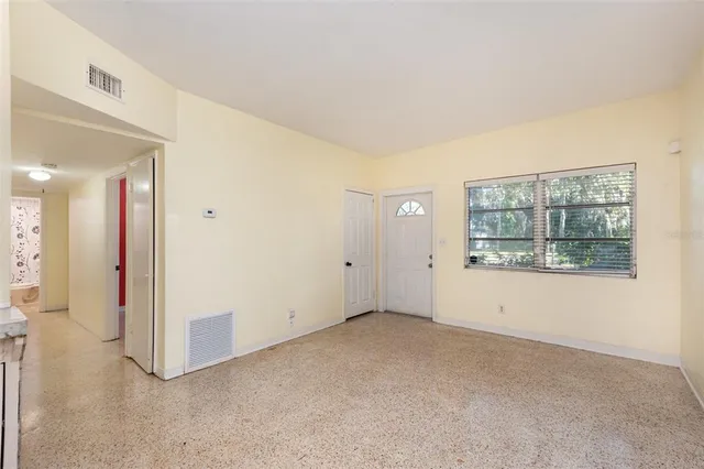 a view of an empty room with a window