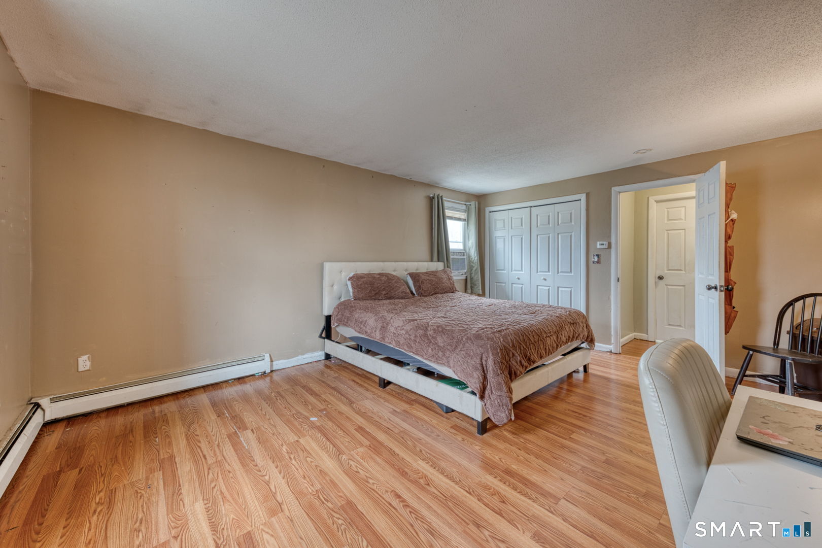 160 Windbrook Drive Windsor, CT 06095 - Photo 18 of 35 a bedroom with a bed and wooden floor