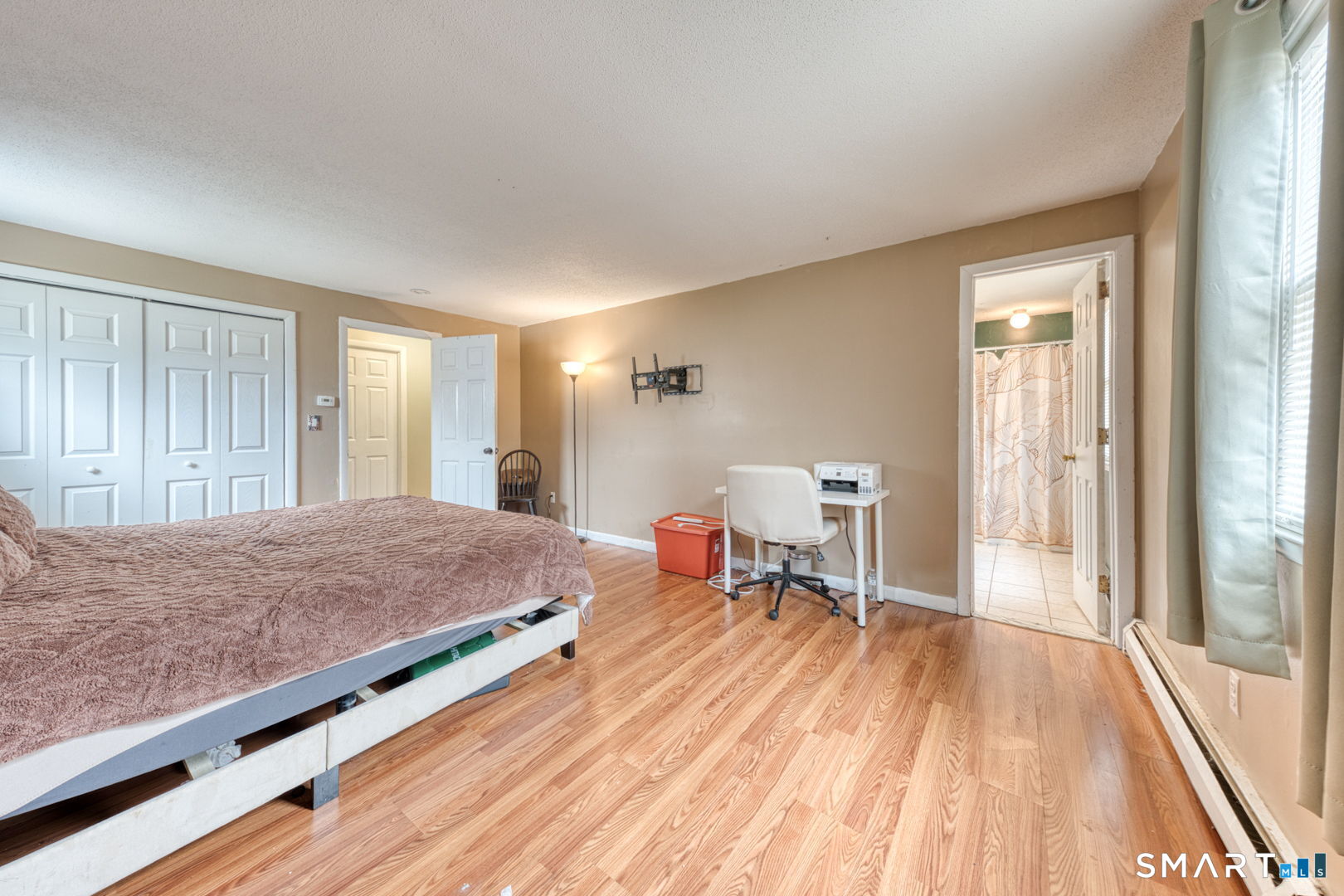 160 Windbrook Drive Windsor, CT 06095 - Photo 19 of 35 a bedroom with a bed and wooden floor