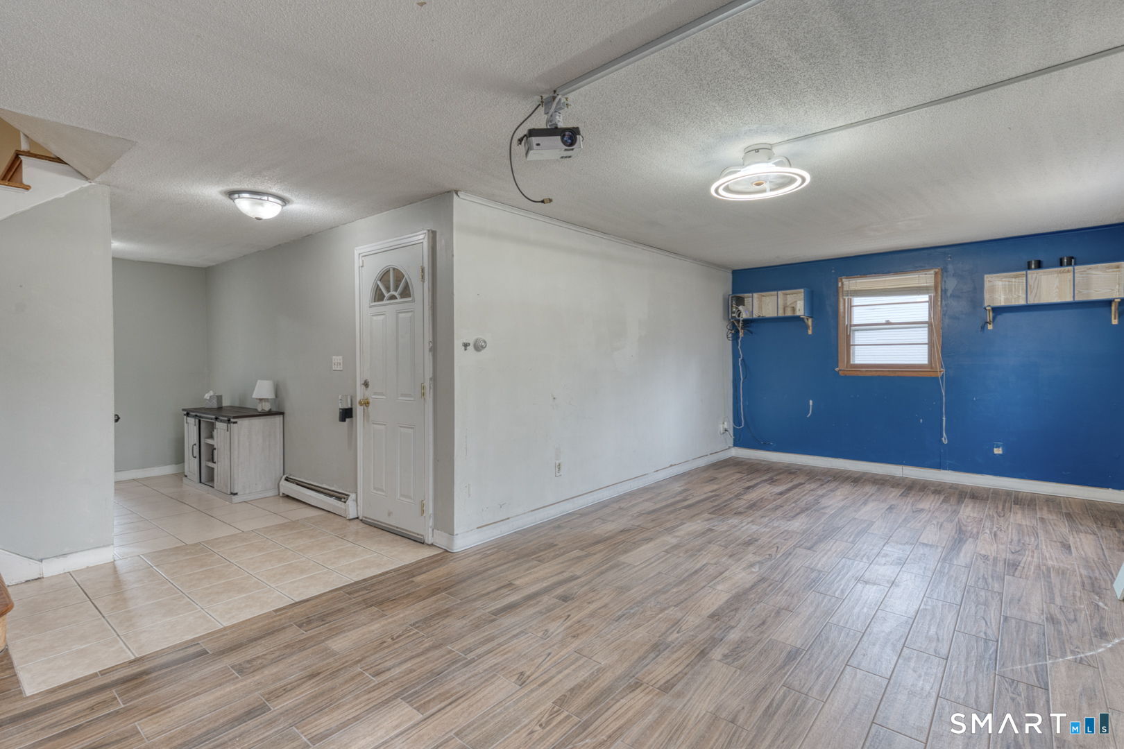 160 Windbrook Drive Windsor, CT 06095 - Photo 22 of 35 wooden floor in an empty room with a window