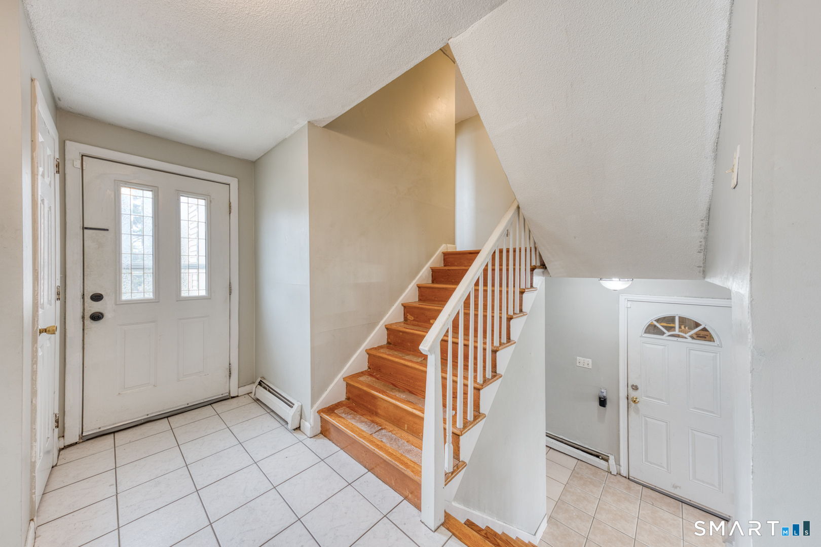 160 Windbrook Drive Windsor, CT 06095 - Photo 3 of 35 a view of a hallway with entryway wooden floor and windows