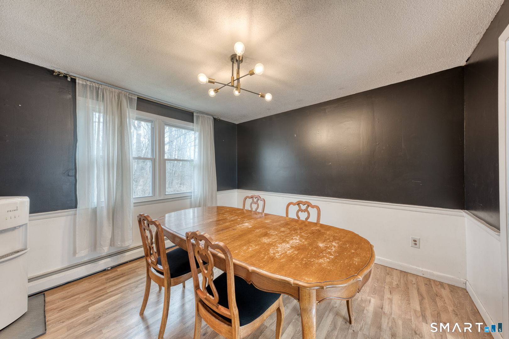 160 Windbrook Drive Windsor, CT 06095 - Photo 9 of 35 a view of a dining room with furniture and wooden floor