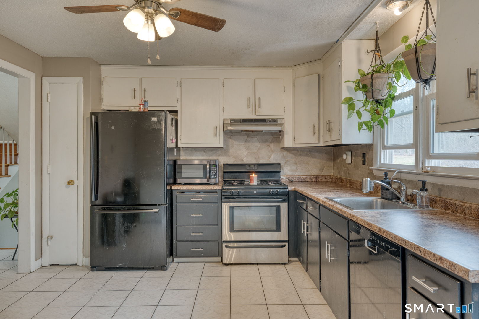 160 Windbrook Drive Windsor, CT 06095 - Photo 10 of 35 a kitchen with stainless steel appliances granite countertop a refrigerator sink and stove