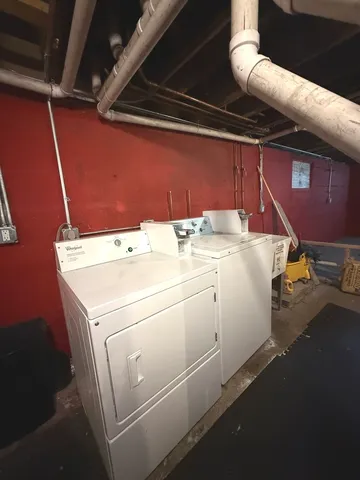 a view of a bathroom with a bathtub and shower