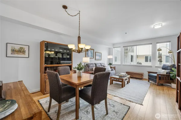 a view of a dining room with furniture window and wooden floor