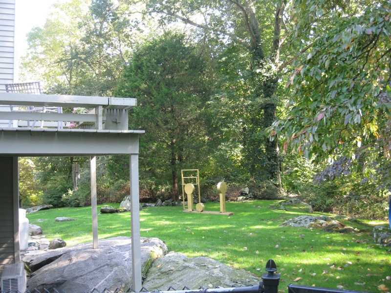 29 Angus Lane Greenwich, CT 06831 - Photo 11 of 14 a view of a house with a yard