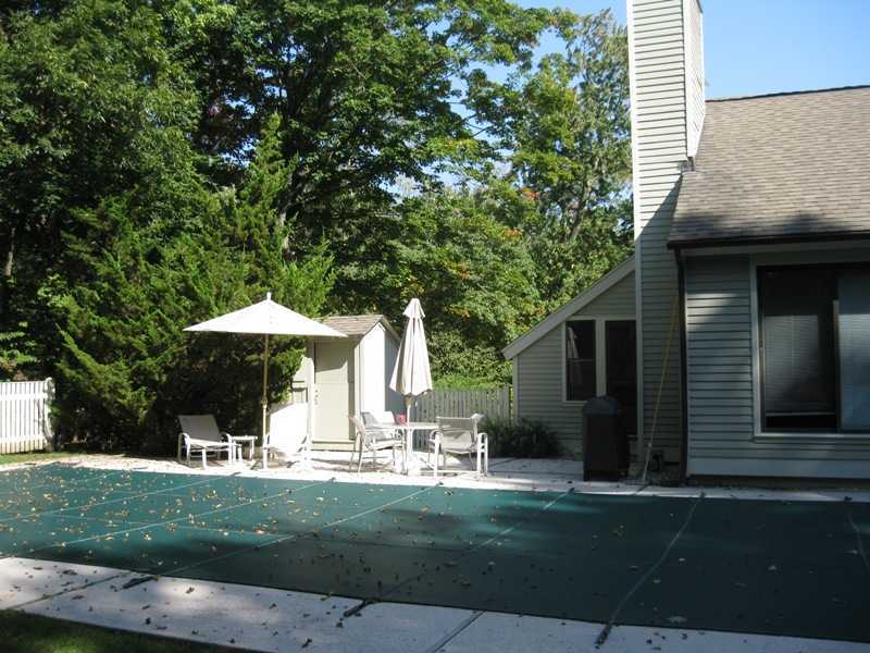 29 Angus Lane Greenwich, CT 06831 - Photo 12 of 14 a front view of a house with a yard