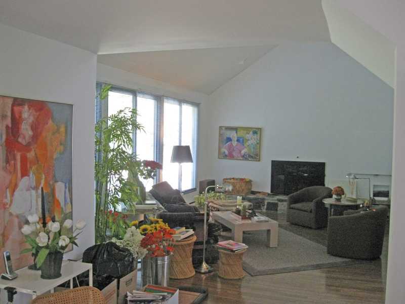 29 Angus Lane Greenwich, CT 06831 - Photo 2 of 14 a living room with furniture potted plant and a large window