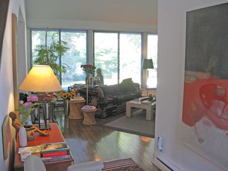 29 Angus Lane Greenwich, CT 06831 - Photo 5 of 14 a room with furniture a rug potted plant and a large window