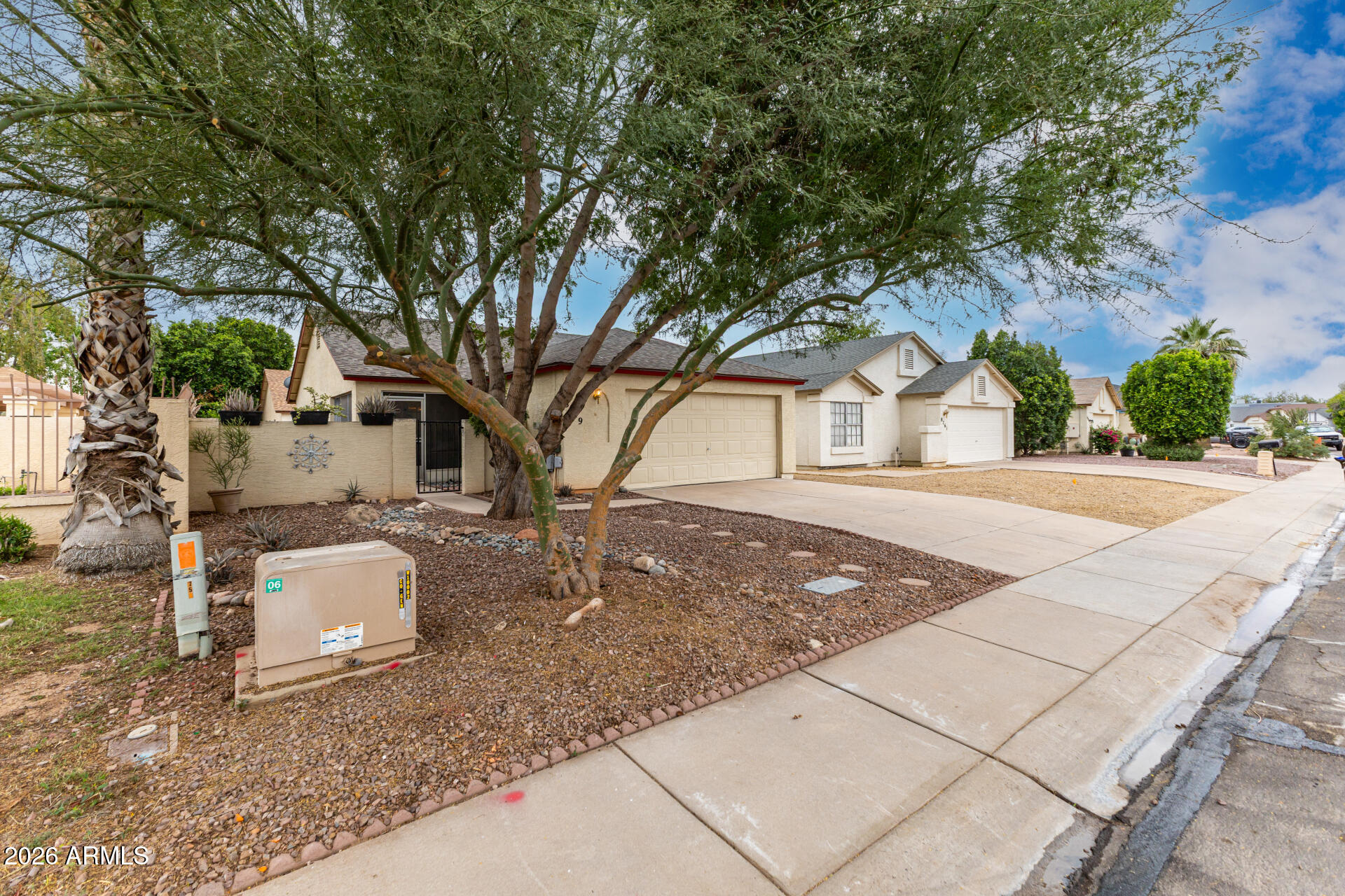8759 West St John Road Peoria, AZ 85382 - Photo 3 of 27 a front view of a house with a yard