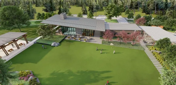 an aerial view of a house with swimming pool garden view and trees