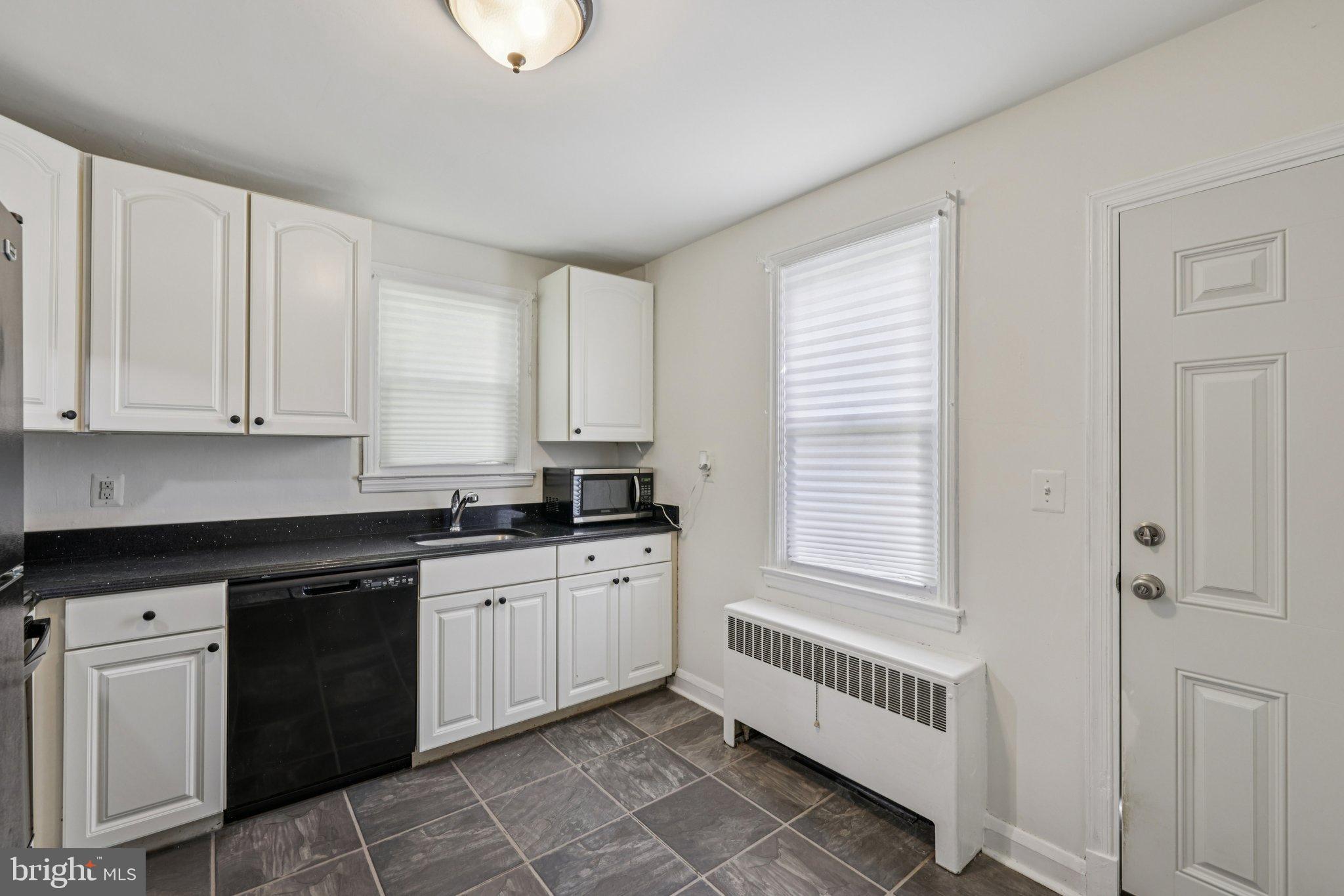 6907 Moyer Avenue Baltimore, MD 21234 - Photo 13 of 48 Bright and modern kitchen with sleek finishes.