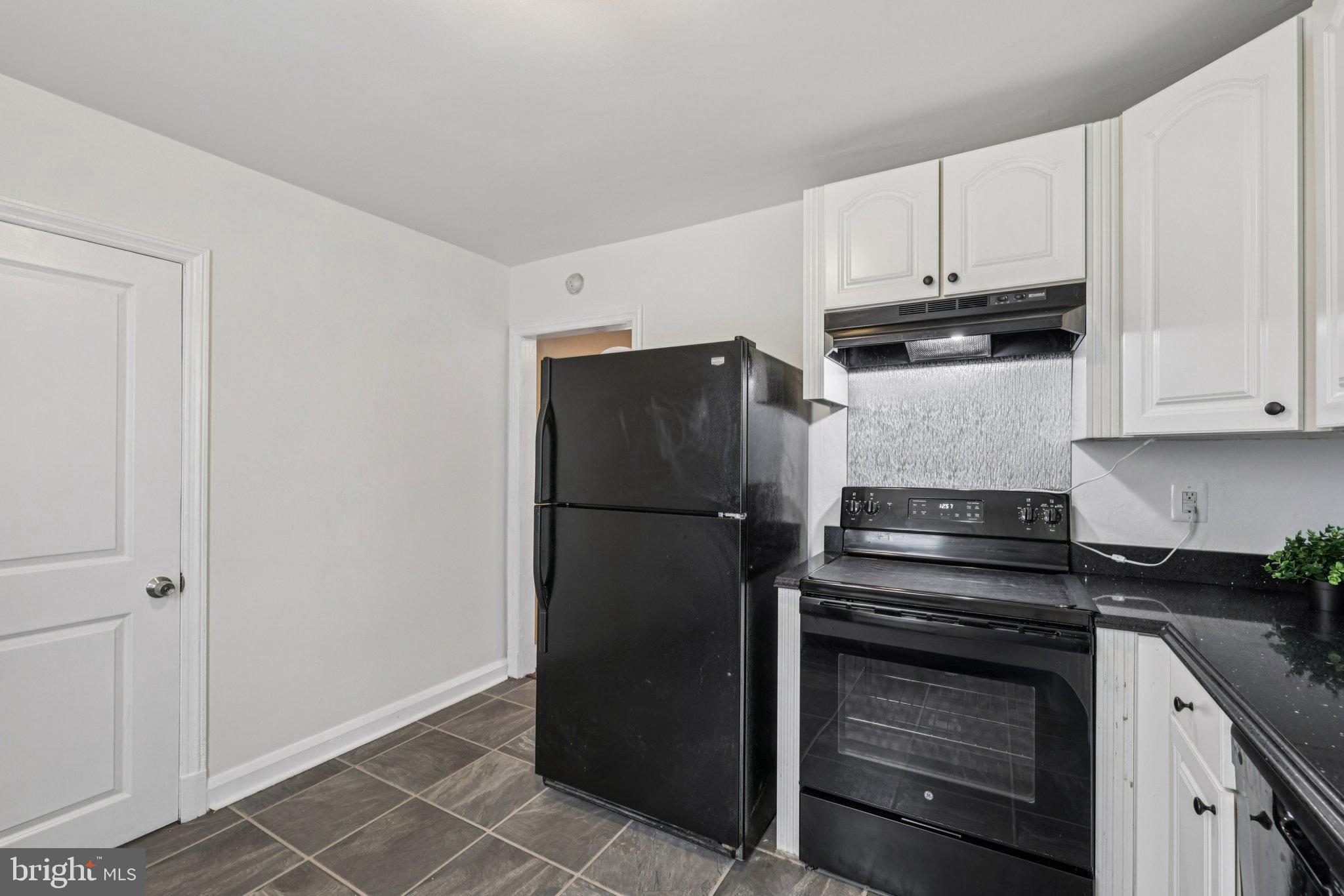 6907 Moyer Avenue Baltimore, MD 21234 - Photo 14 of 48 Modern kitchen with sleek appliances.