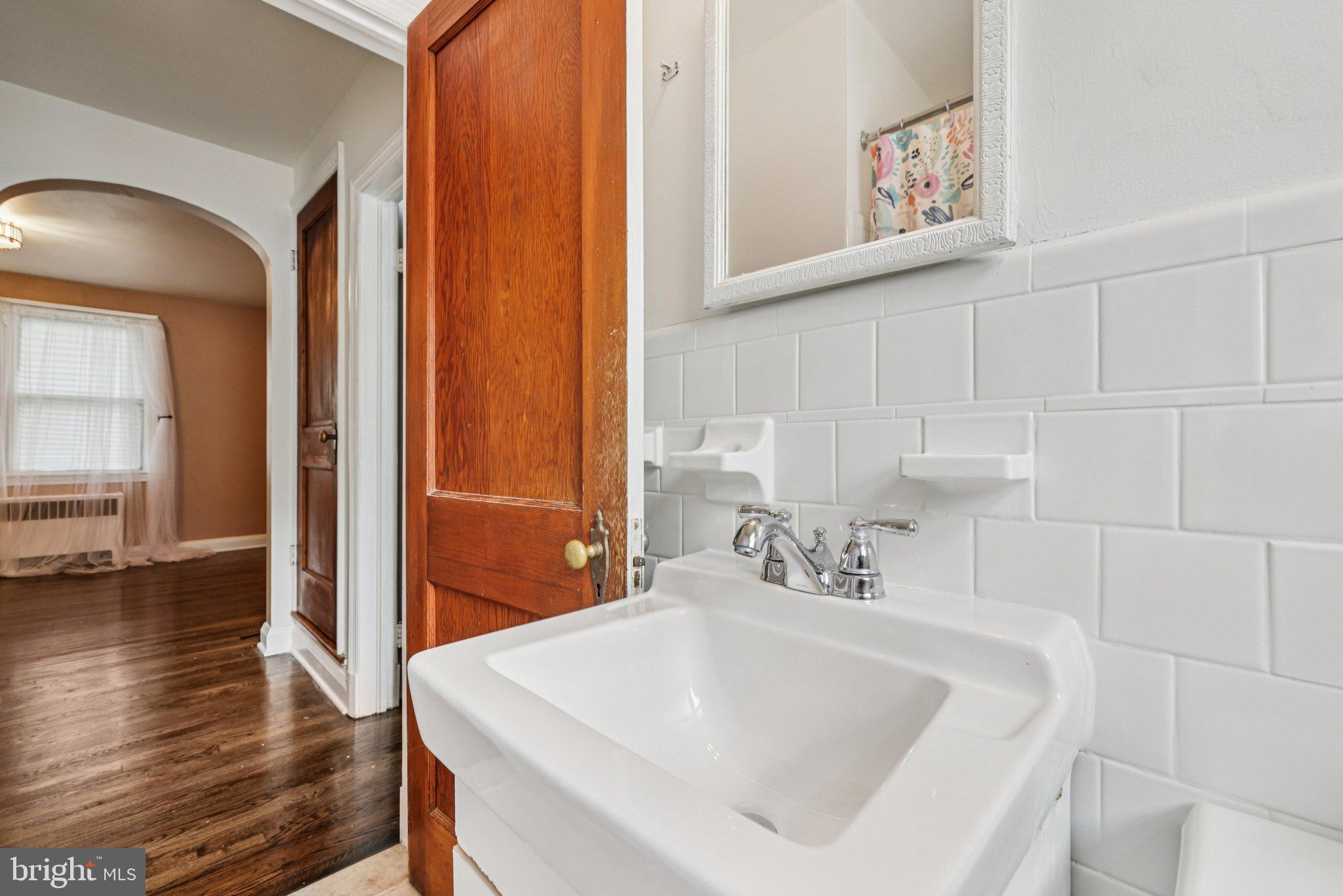 6907 Moyer Avenue Baltimore, MD 21234 - Photo 17 of 48 Charming bathroom with classic tile accents.