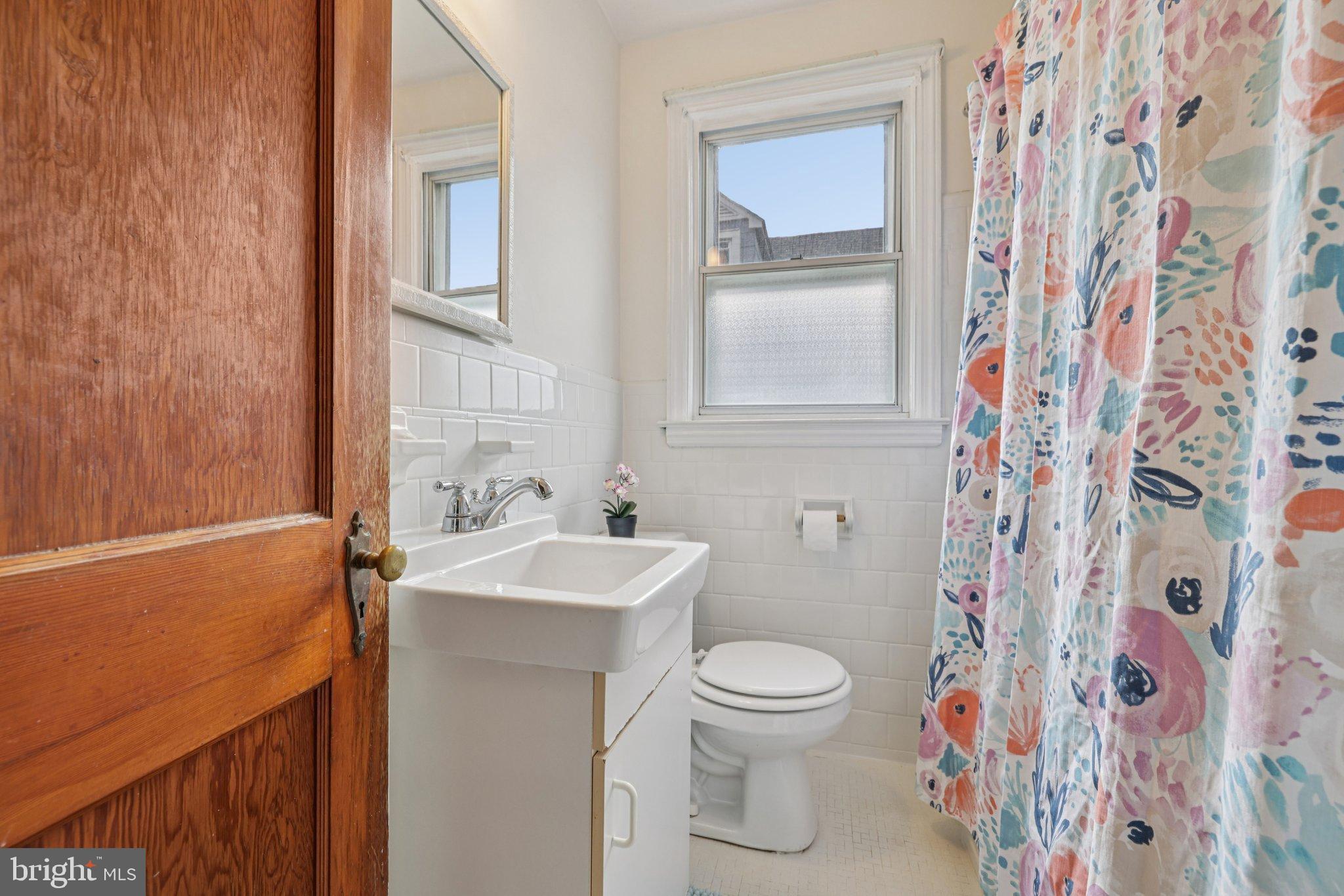 6907 Moyer Avenue Baltimore, MD 21234 - Photo 18 of 48 Bright and cheerful bathroom retreat.