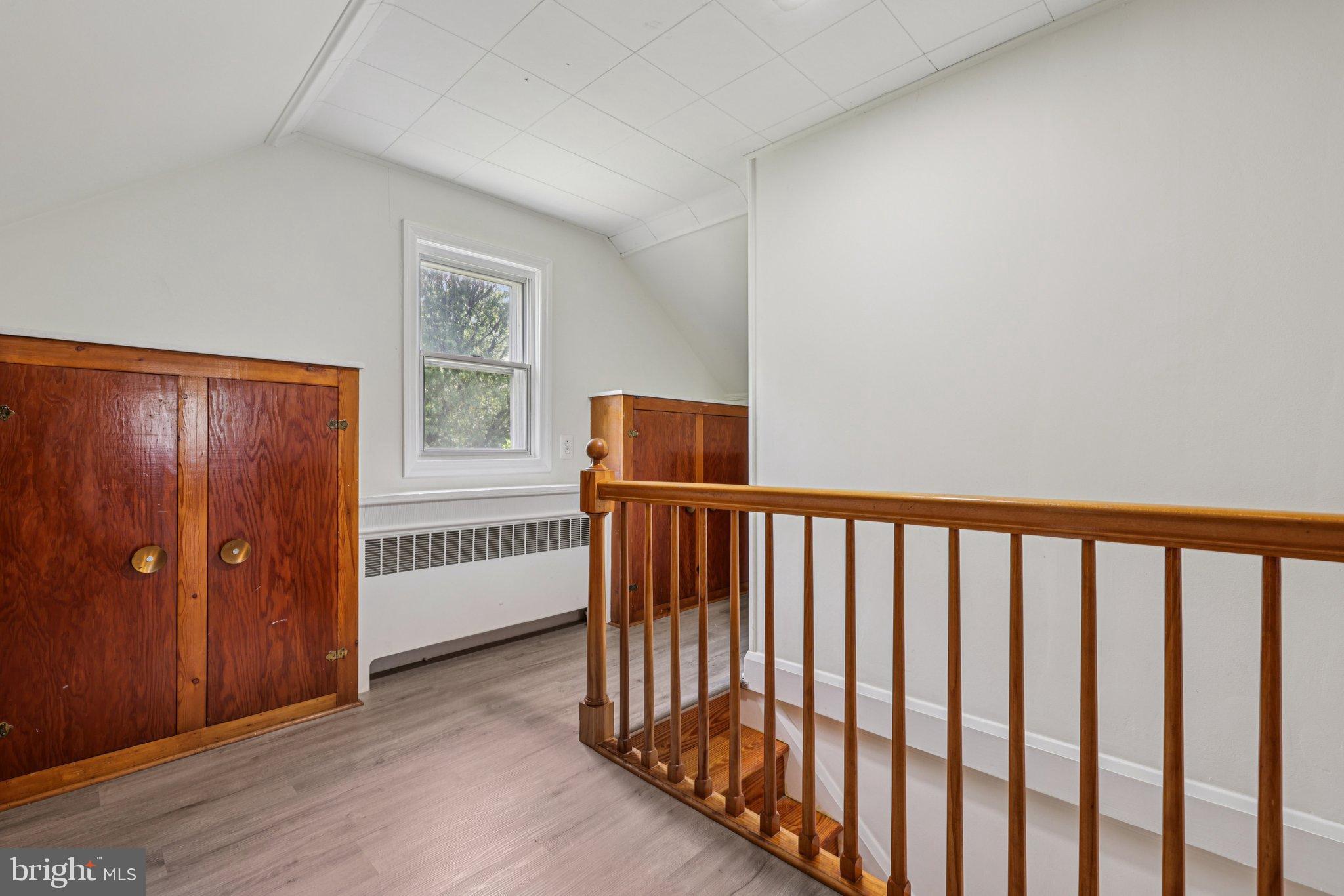 6907 Moyer Avenue Baltimore, MD 21234 - Photo 24 of 48 Bright and airy landing with wooden accents.